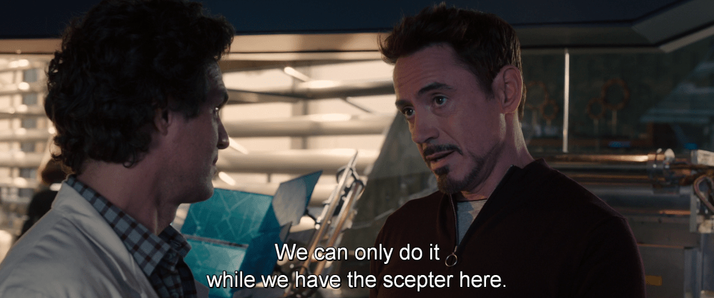 Back in the lab, Tony discusses with Bruce, 