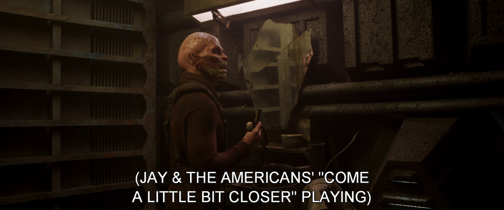 Member of Yondu's mutinous former crew stands in front of a mirror. Subtitles read, 