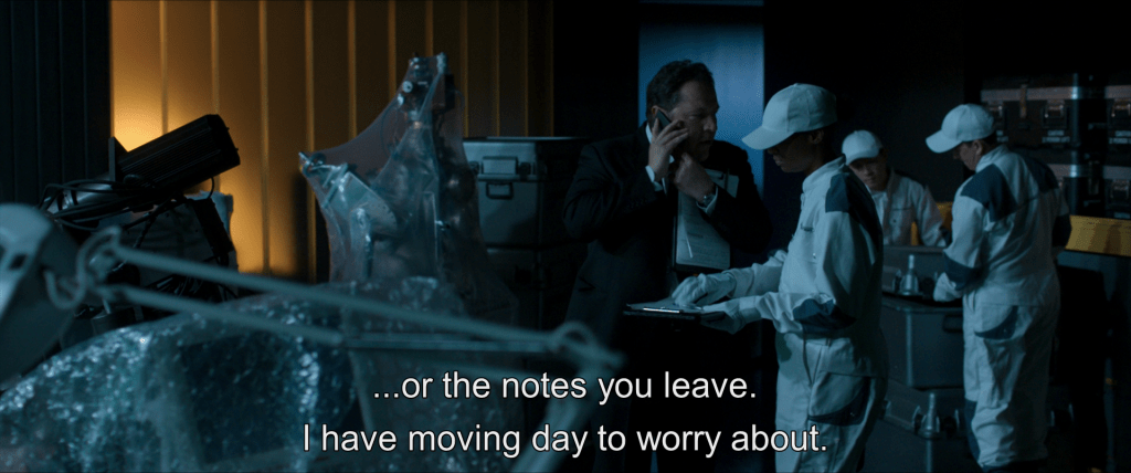 Happy Hogan talks to Peter on his cell phone while overseeing packing in Avengers tower.