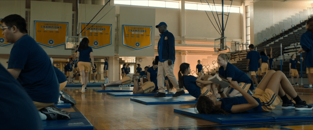 Midtown High gymnasium. Banners along the far wall list years of championships, the most recent being 2009.