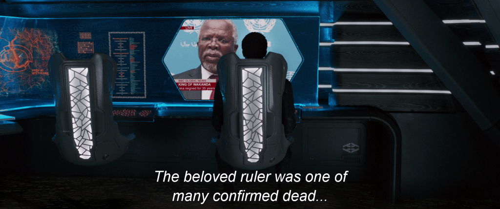 T'Challa watches a news broadcast about the death of his father. "The beloved ruler was one of many confirmed dead…"